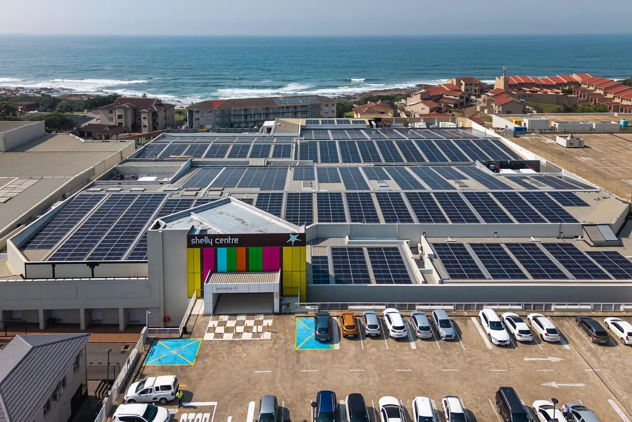 Shelly Centre rooftop solar array, aerial view towards the coast, Shelly Beach